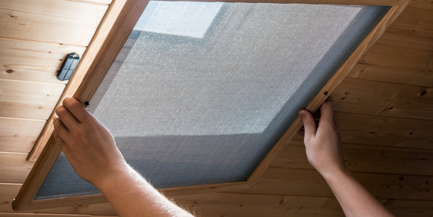 Installing homemade mosquito net on velux window on ceiling